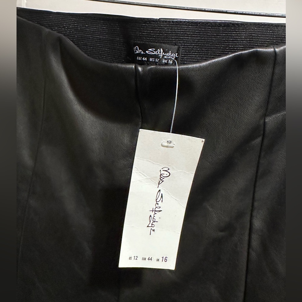Never worn bell bottom faux leather, high-waisted pants.